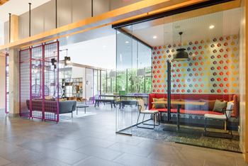 a lobby with furniture and a large glass wall at The Chase at Bryant Street, Washington